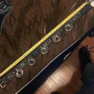 Genuine leather bondage belt with stainless steel triple O rings in the belt.